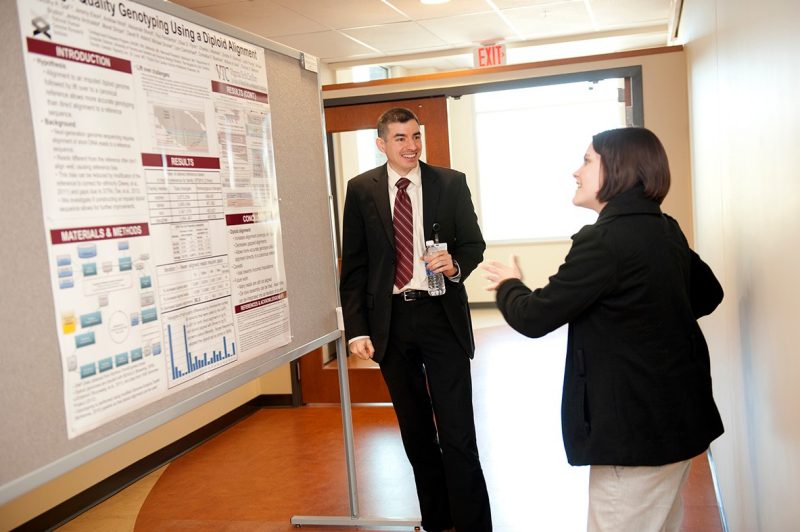  students Timothy Gall and Rebecca Kirschner discuss a research project.