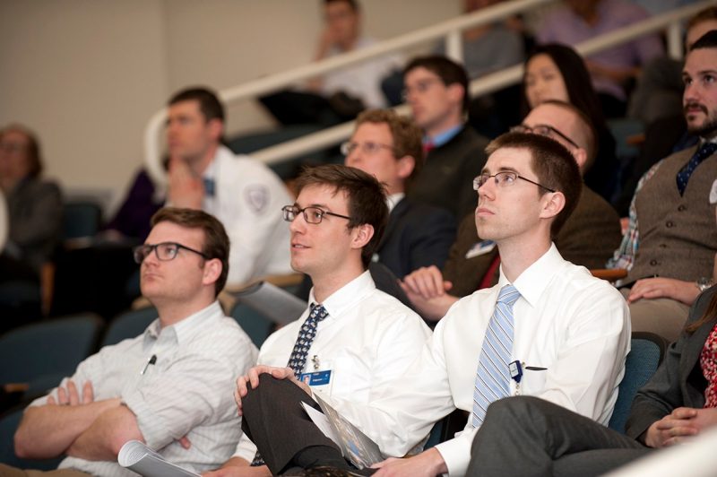 Virginia Tech Carilion School of Medicine students watch their classmate's presentation.