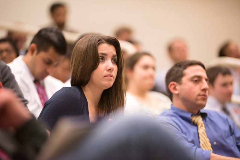 Erin Straight, a member of the Class of 2015, listens during the oral presentations. 