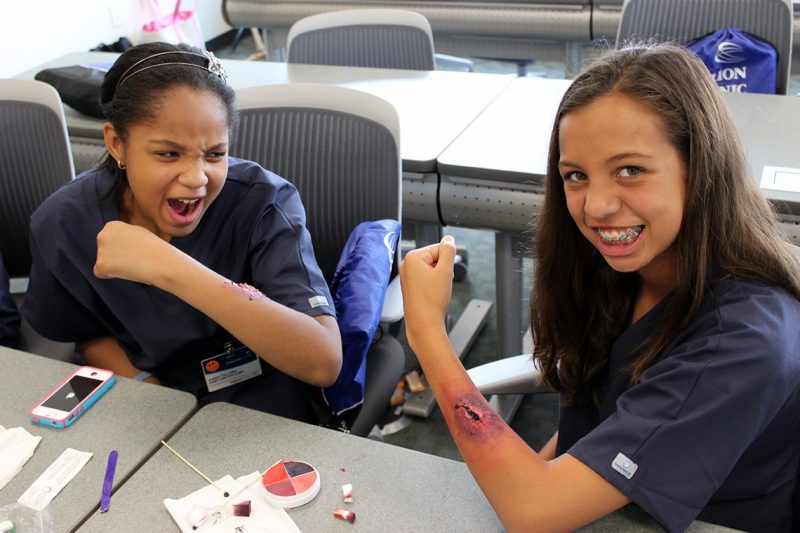  Two participants in Camp Carilion show off the gashes they gave themselves using makeup.