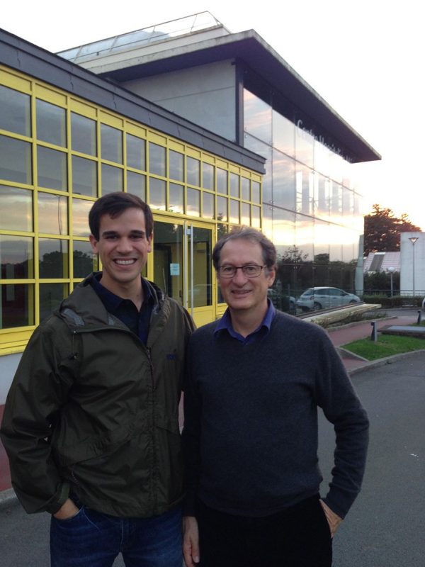 Robbie Varipapa '15 stands with Dr. Thierry Lugbull outside Memorial Hospital in Saint-Lô France.