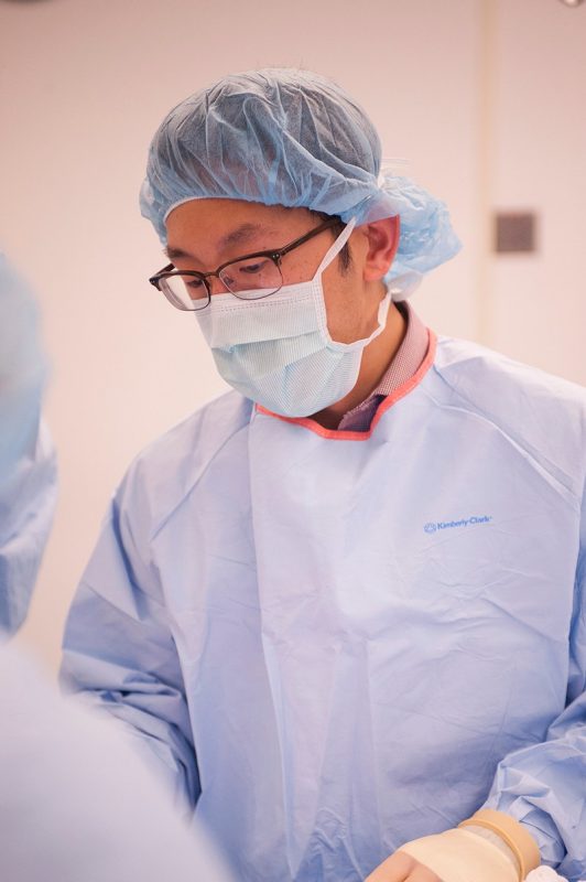 Yu-Wei Chang '16 is ready to begin surgery on a mock victim who needs a leg amputation.