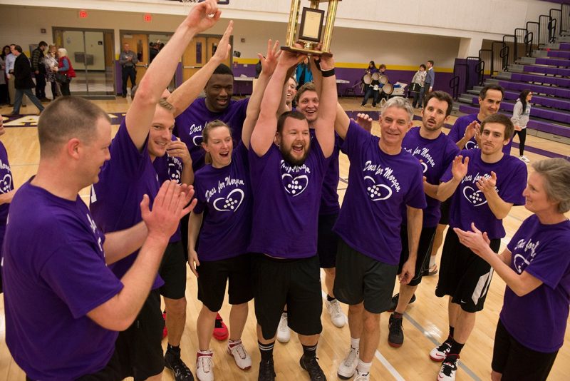 "Docs" raise a trophy after winning the 4th annual "Docs for Morgan" basketball game.