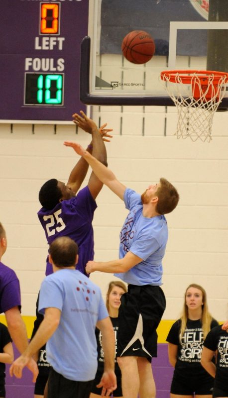 Players go up for a rebound during the 4th annual "Docs for Morgan" basketball game.