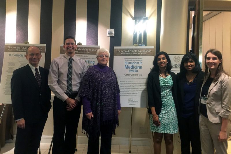 Carol Gilbert with Aubrey Knight, associate dean for students affairs, and the school's OSR representatives who put together her nomination: second-year student Cody Roberts, fourth-year student Silpa Thaivalappil, third-year student Alyssa Savelli, and first-year student Anisha Chada, during an awards luncheon.