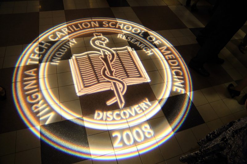 Virginia Tech Carilion School of Medicine’s seal projected onto the floor of Jefferson Center