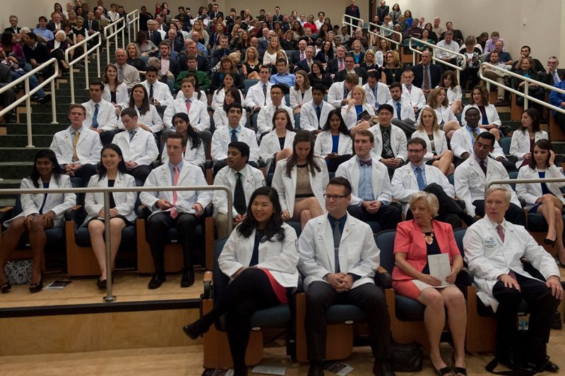The members of the Class of 2018 in their white coats for the first time.