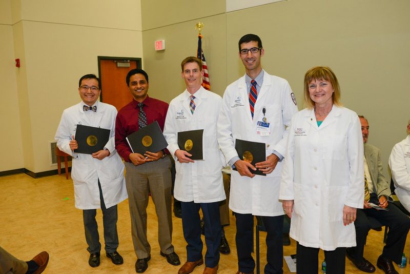 Dean Cynda Johnson stands with four Carilion Clinic resident physicians who were recognized for outstanding contributions by the Virginia Tech Carilion School of Medicine's Class of 2017.