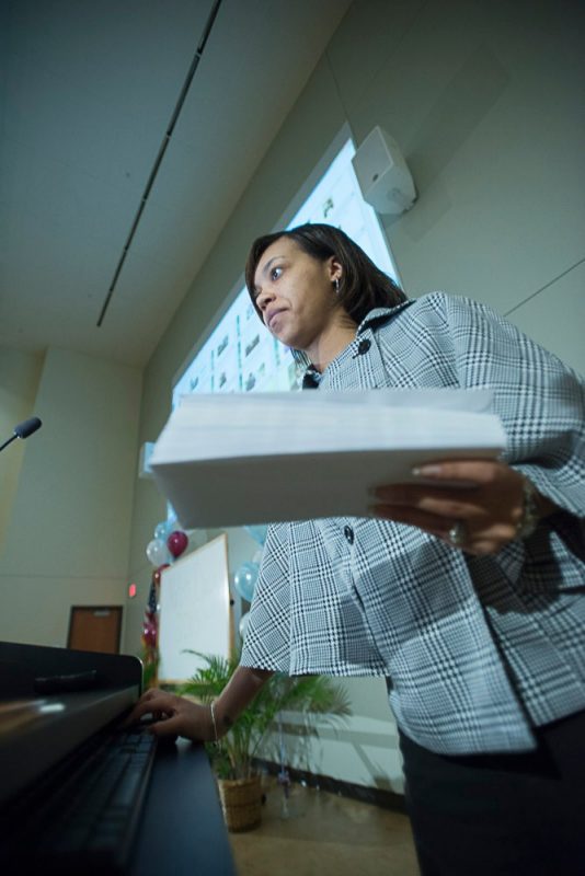 Angelica Stovall, business manager for student affairs, holds the magic envelopes.
