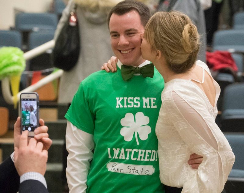 Third-year student Caroline Reist kisses fourth-year student Christopher McLaughlin