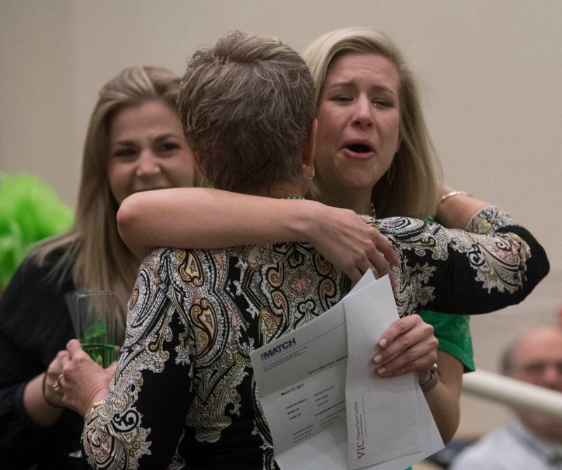 Kendall Hancock breaks out with emotion and hugs a family member as she reads her Match Day letter.