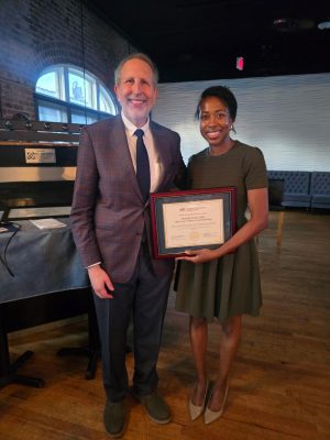 Dean Lee Learman presenting Deans Academic Excellence Award to Dr. Danielle Lewis
