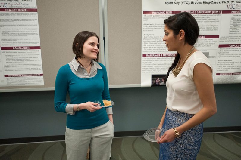 students Rebecca Kirschner and Mina Lotfi discuss their research projects.