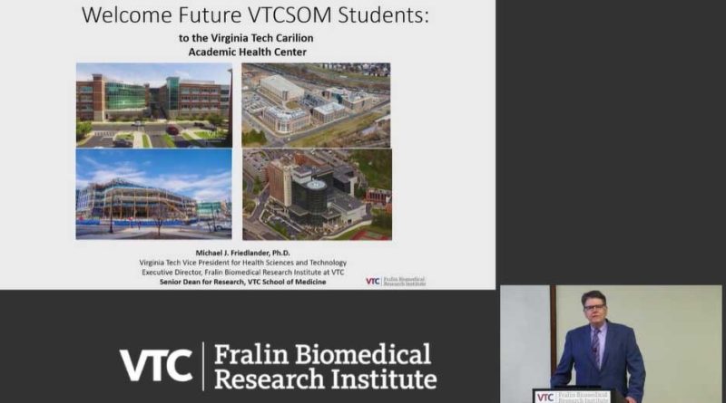Dr. Mike Friedlander giving a presentation. Slide reads Welcome Future VTCSOM Students to the Virginia Tech Carilion Academic Health Center