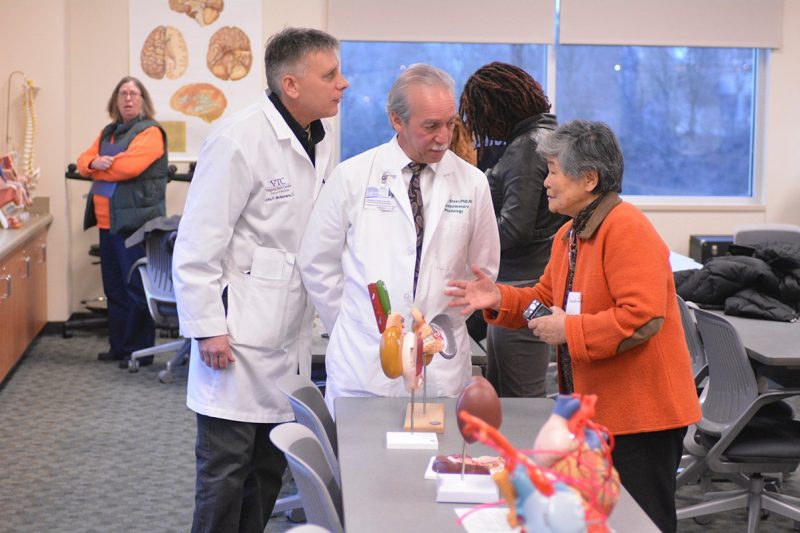 Drs. John McNamara (l) and George Steer, faculty members at the Virginia Tech Carilion School of Medicine answer participants' questions about how various organs work.