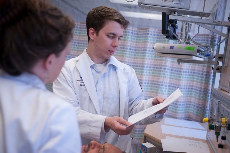 Zane Giffen '16 reviews the charts of a trauma patient.