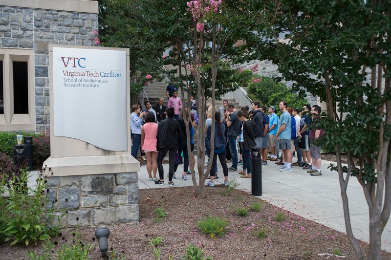 Students gather at the entrance of the Virginia Tech Carilion School of Medicine to begin the third annual Public Health Walk.