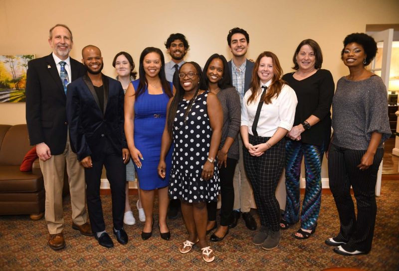 Ten recipients of the VTCSOM Dean's Diversity Champion Awards gather with dean Lee Learman for a group photo.