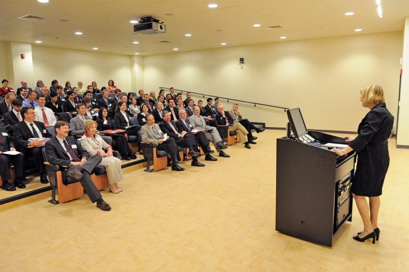 Dean Cynda Johnson addresses a lecture hall with students and administrative leaders