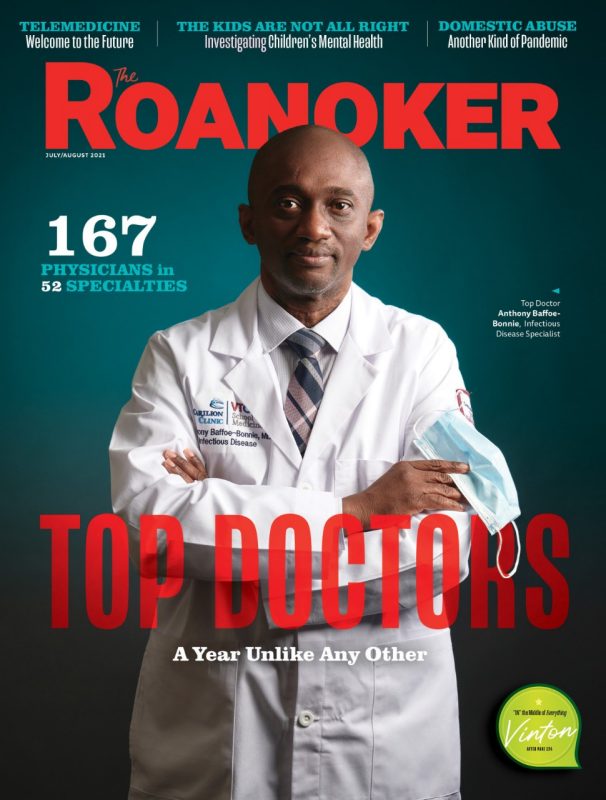 Roanoker Magazine Top Doctors. Dr. Anthony Bonnie-Bafoe is featured on the front cover wearing his white coat and holding a mask
