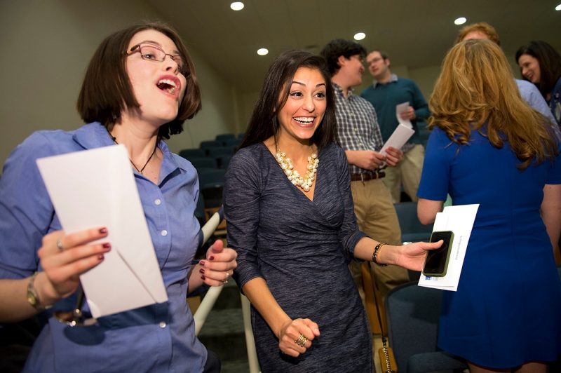 Rebecca Kirschner (l) and Mina Lotfi breathe a sign of relief after they open their envelopes