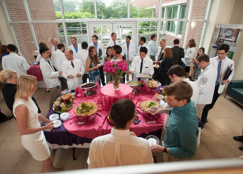 Faculty, students, and visitors gather at a reception after the Virginia Tech Carilion School of Medicine's Student Clinician's Ceremony for the Class of 2017.