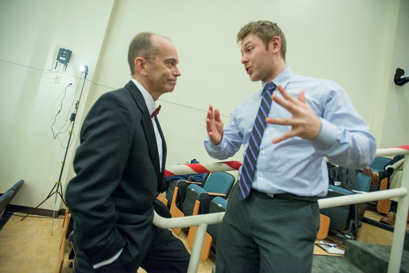 Student Boris Kiselev talks to Dr. Aubrey Knight, associate dean for student affairs.