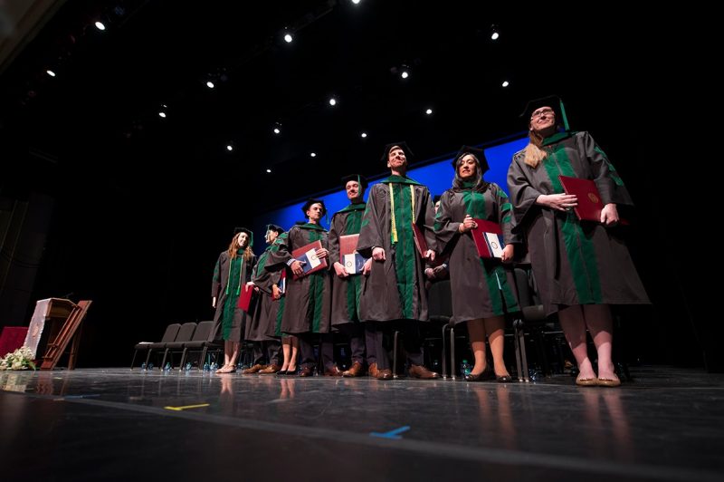 Members of the Virginia Tech Carilion School of Medicine stand and are recognized upon completion of the school's 2016 graduation exercises.