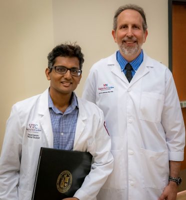 Medical student Varun Kavuru stands beside Dean Lee Learman